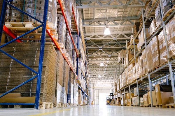 Shelving lining an e-commerce warehouse full of products and boxes of inventory